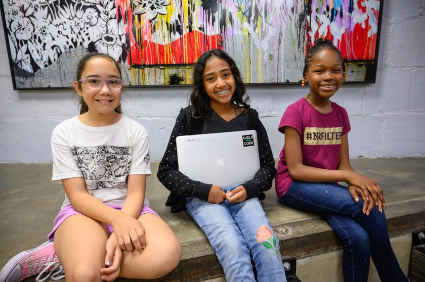 Image of three students in the Girls Who Code program