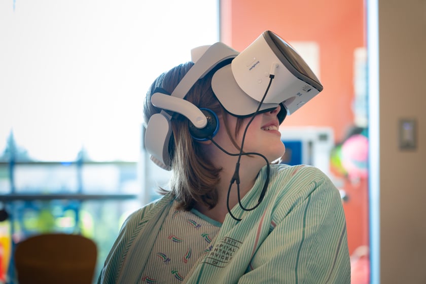 Child in VR headset
