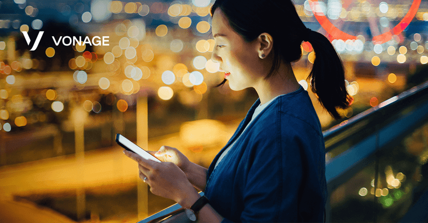 photo of woman holding cell phone and reading something on the screen