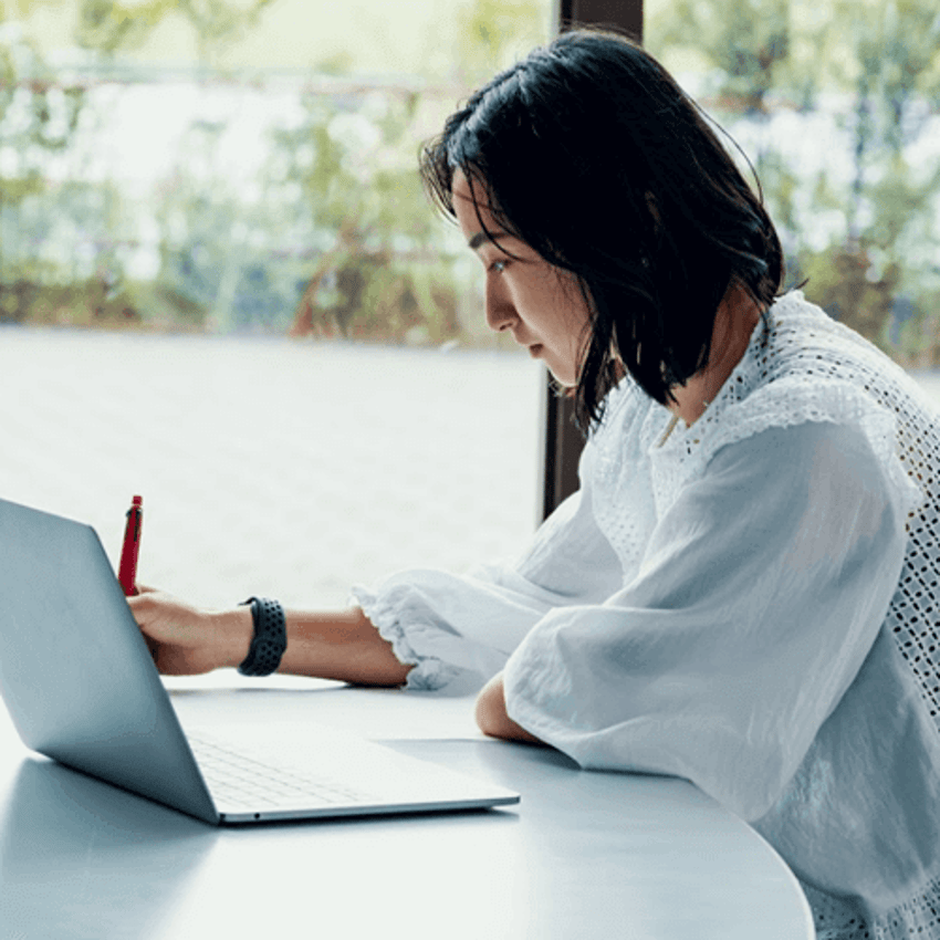 Woman studying on laptop