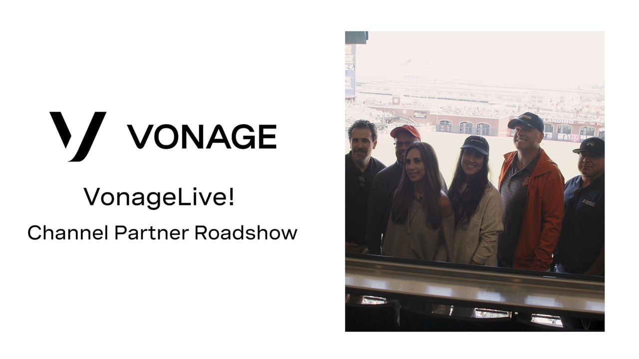 Video frame with the Vonage logo and the words "Vonage Live! Channel Partner Roadshow” and a photo of group of people