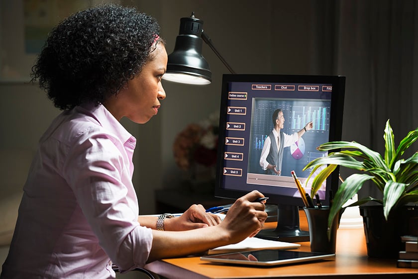 633710077 Woman taking online class on computer